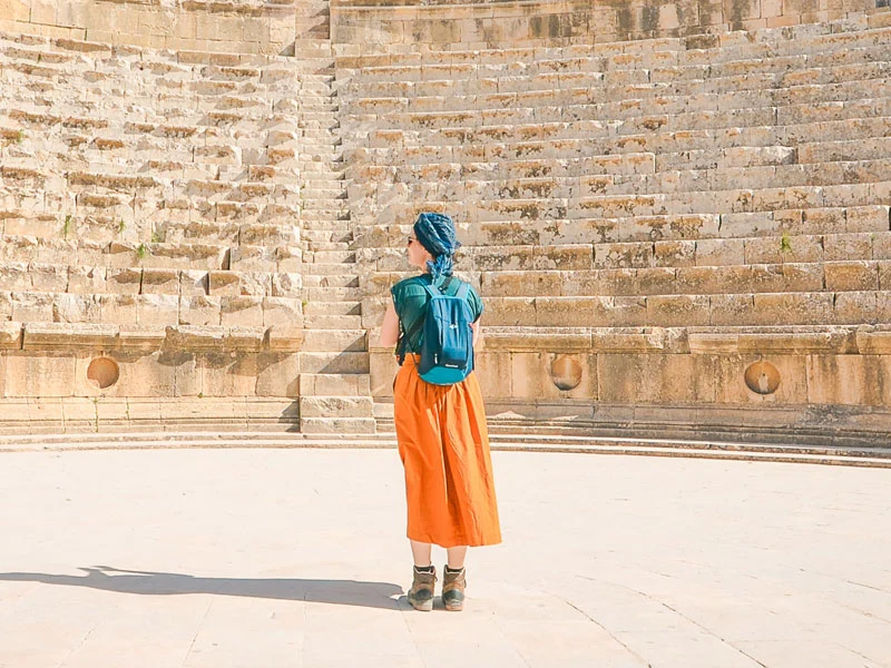 Traveler in Ancient Amphitheater Traveler in Ancient Amphitheater